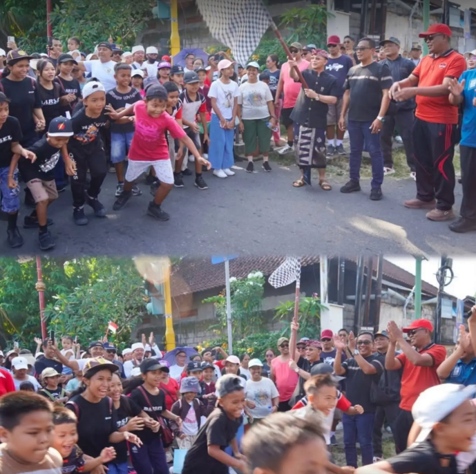 Bupati Klungkung, I Made Satria, melepas kegiatan Jalan Santai HUT ke-81 RI di depan Kantor Desa Banjarangkan
